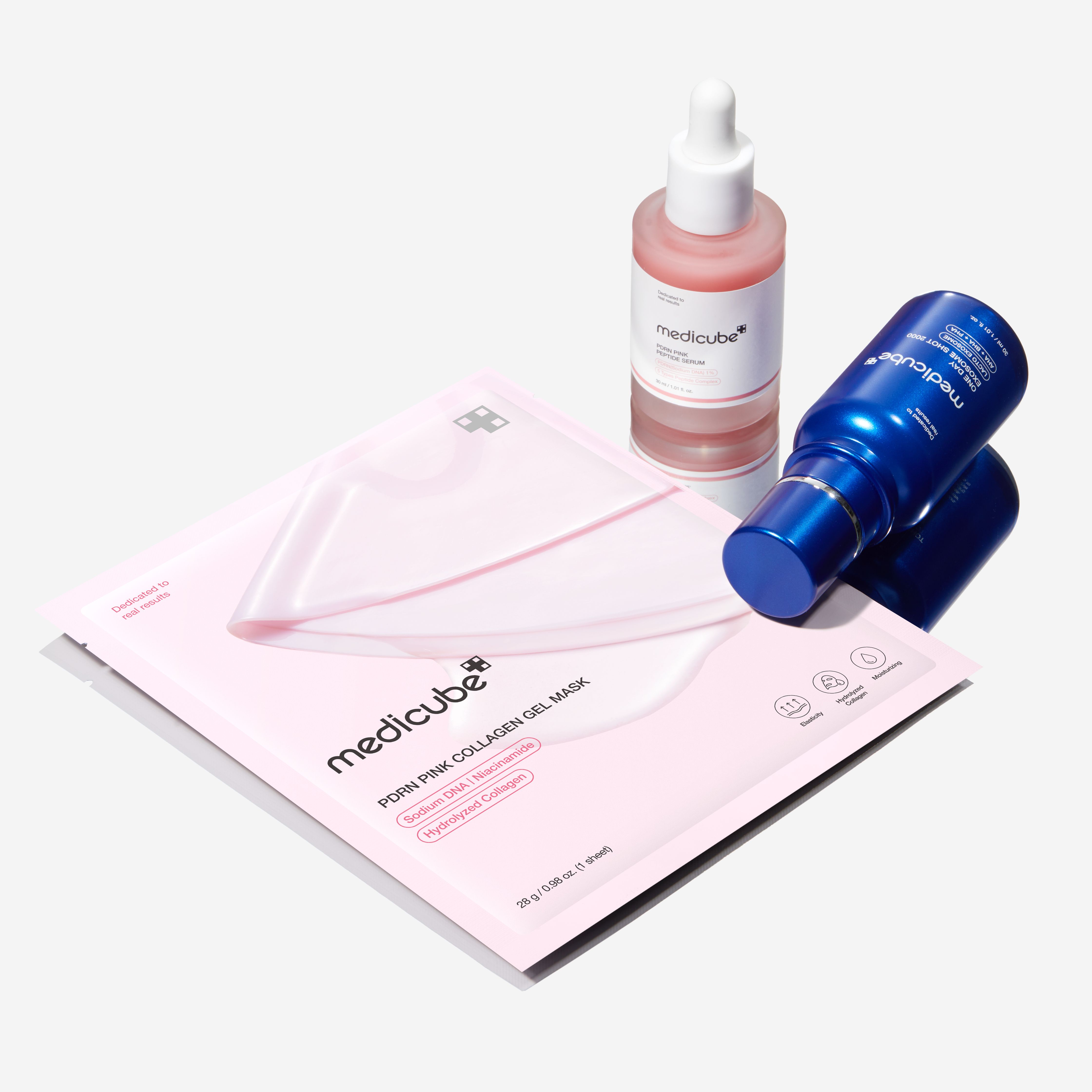 Medicube PDRN Pink Collagen Gel Mask with a pink serum bottle and a blue bottle on a light grey background